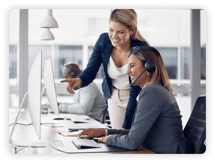 Two people looking at a computer screen